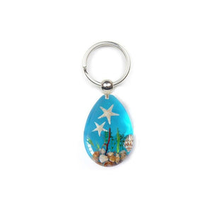 Real Starfish in a Resin with a Blue Background Key Ring - Jurassic Jungle